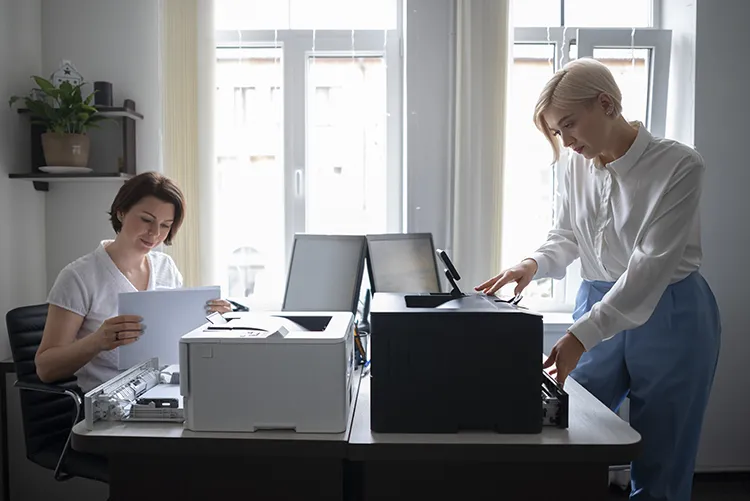 women work office using printer