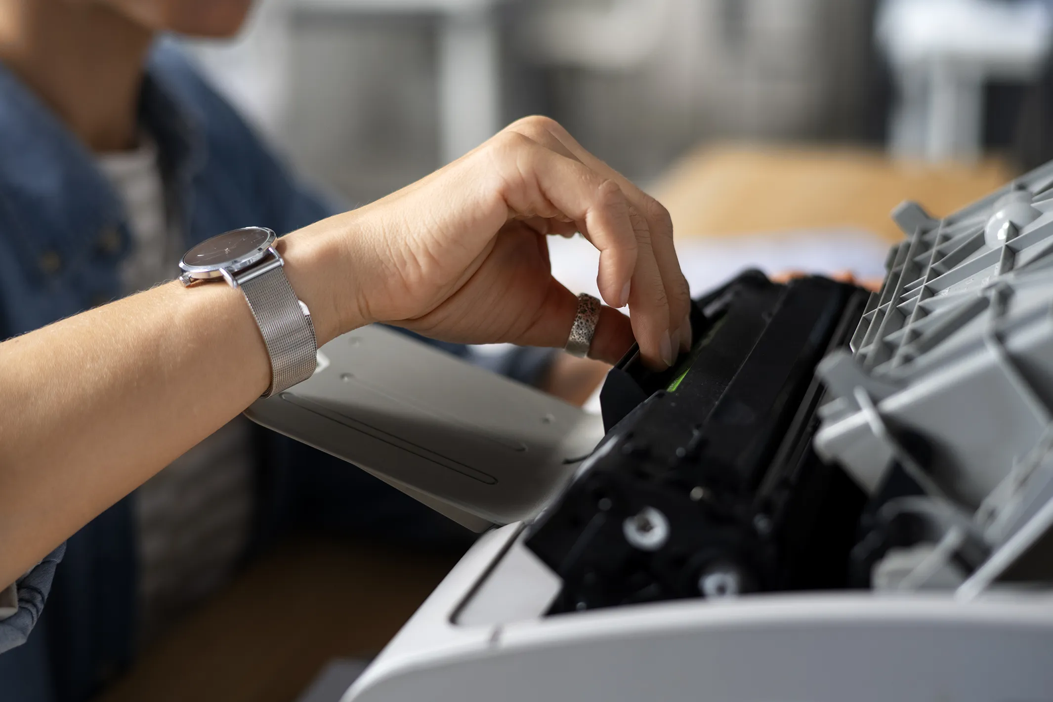 side view worker using printer